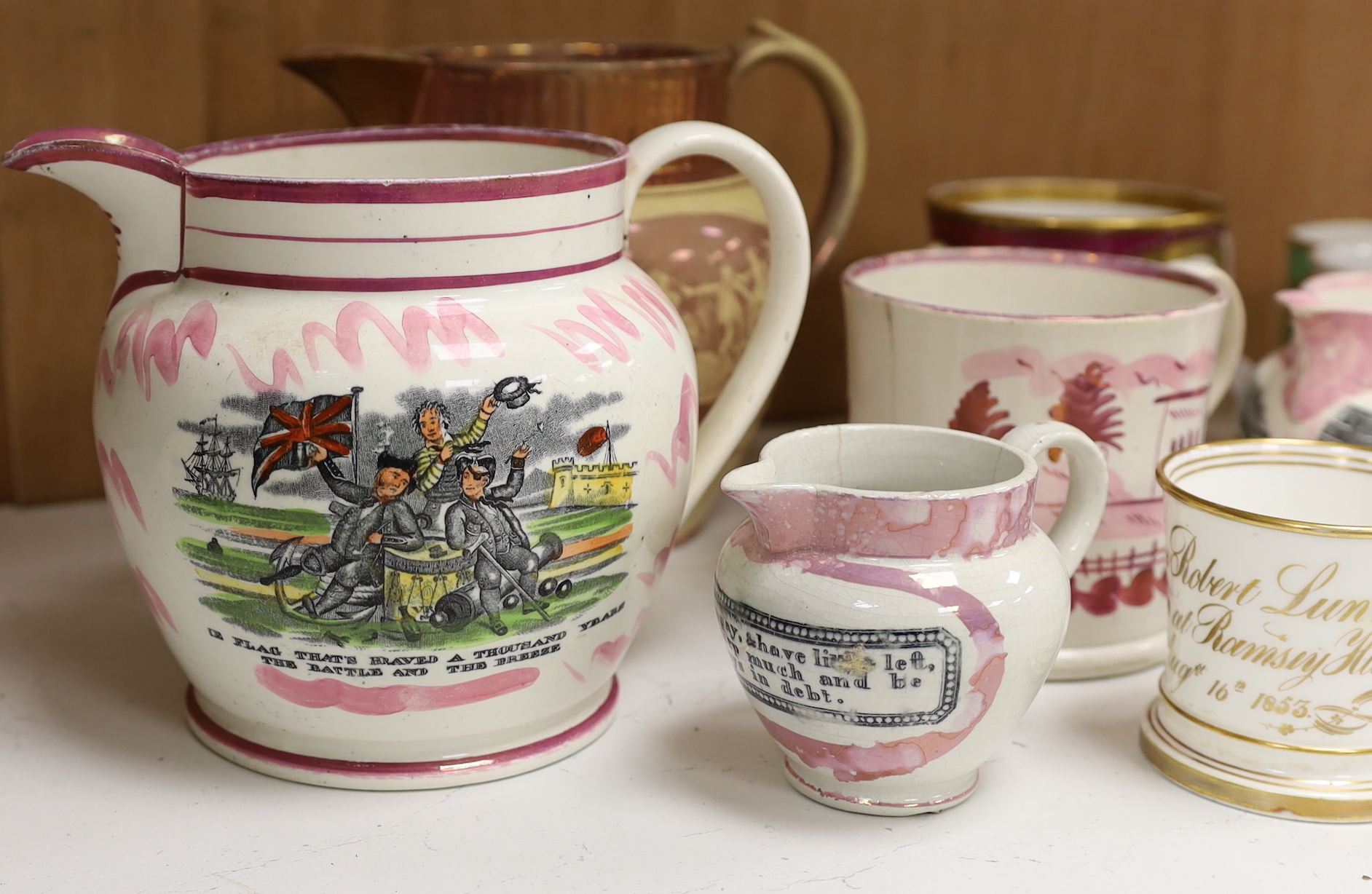 A group of 19th century Staffordshire christening mugs and pink lustre wares
